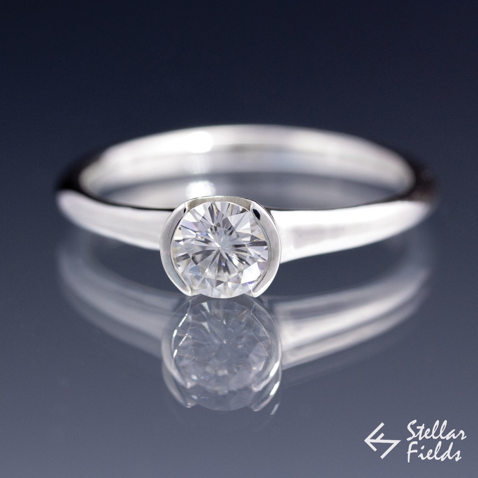 Forever Brilliant™ Round Moissanite Half Bezel Solitaire Engagement Ring - Stellar Fields