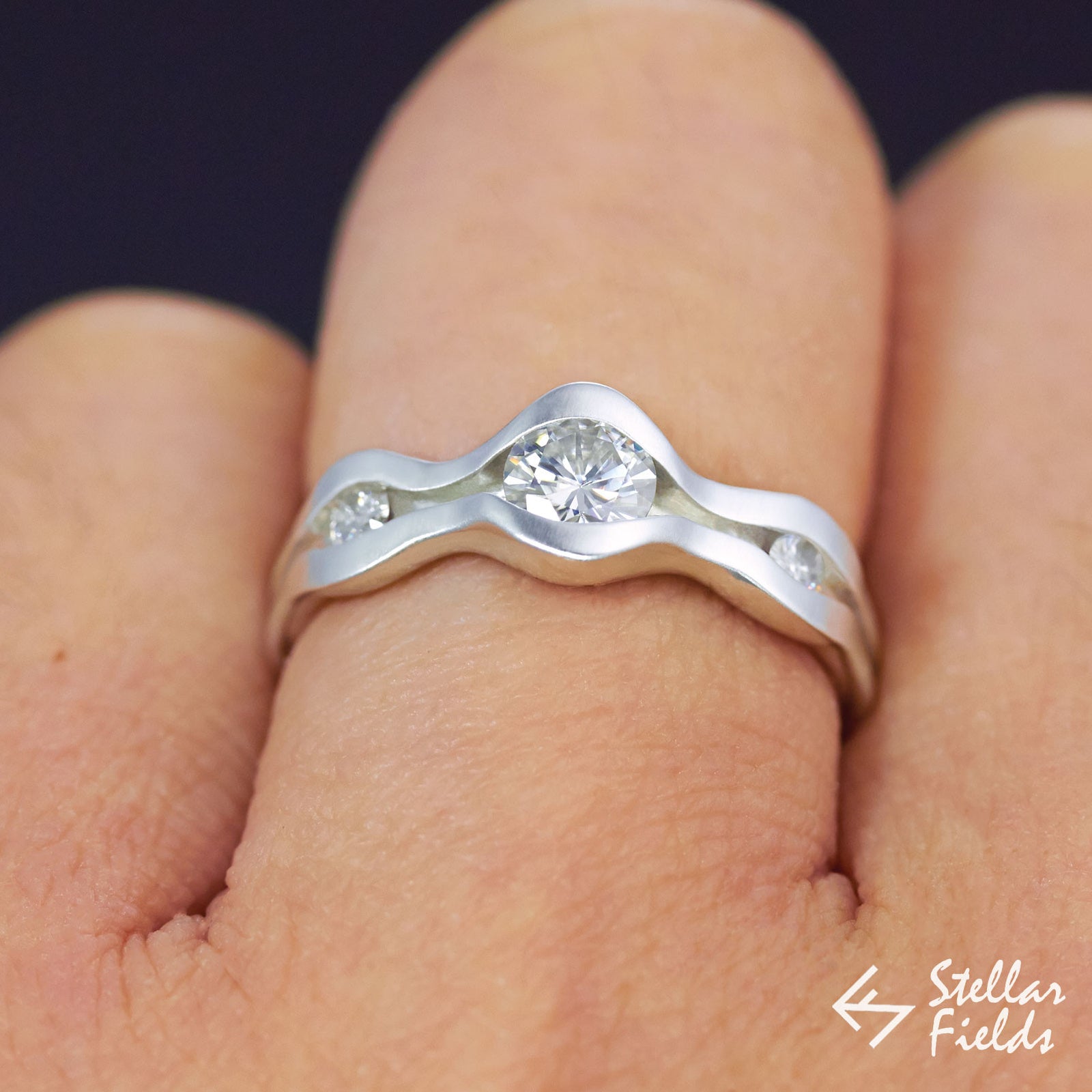 Forever Brilliant™ Moissanite Three Stone Channel Set Wave Engagement Ring - Stellar Fields