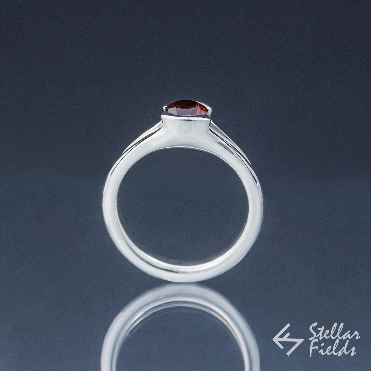 Tension Set Unique Round Red Garnet Ring - Stellar Fields