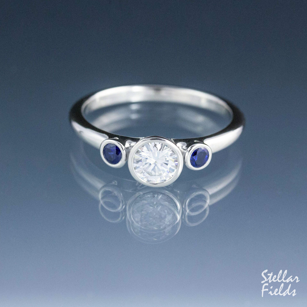 Three Stone Bezel Engagement Ring Moissanite Engagement Ring Blue Sapphire Stellar Fields Jewelry