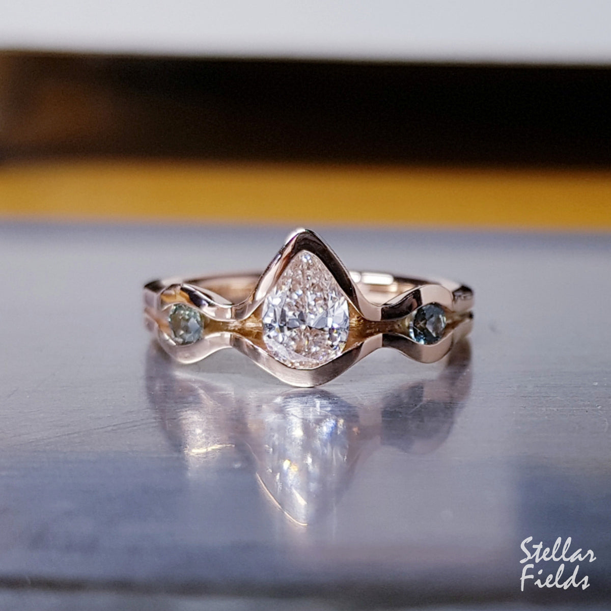 Modern Three Stone Pear Diamond Engagement Ring Teal Montana Sapphire 14k Rose Gold Stellar Fields Jewelry